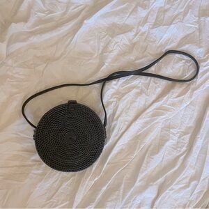 Handwoven black rattan straw circular crossbody bag